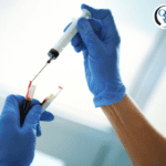 Medical professional in gloves with test tubes of blood