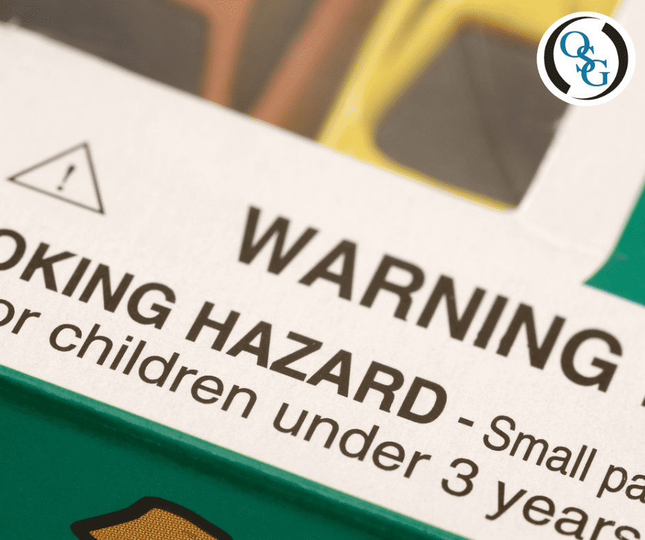 A close-up of a toy package's choking hazard warning label