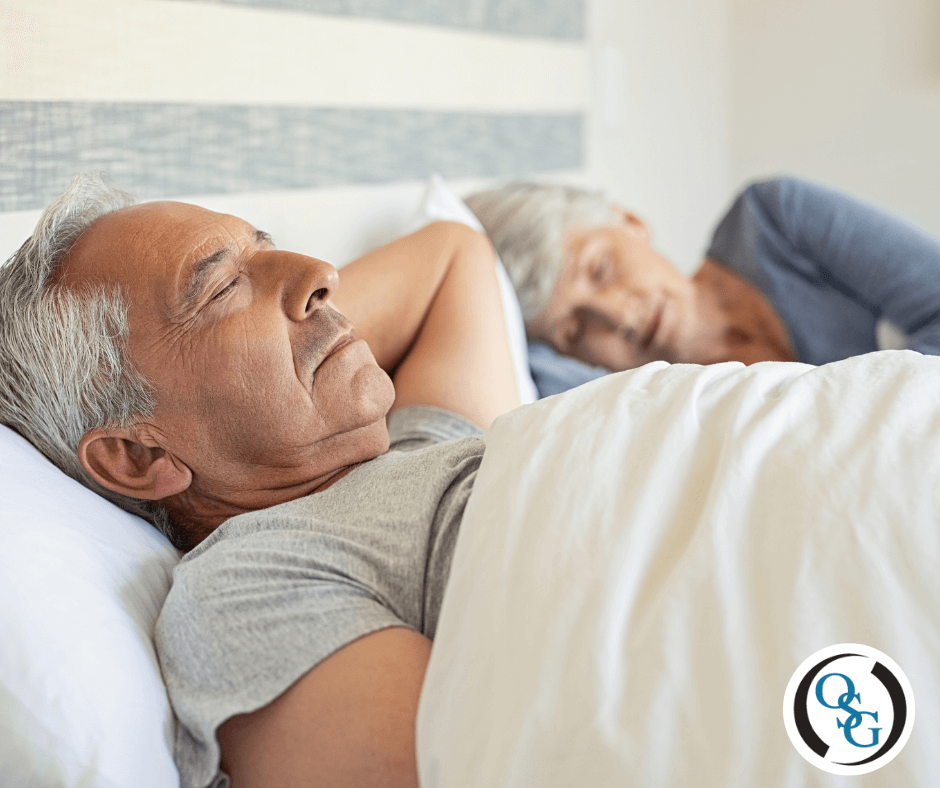 An elderly couple resting in bed