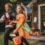 Young kids trick or treating during Halloween.