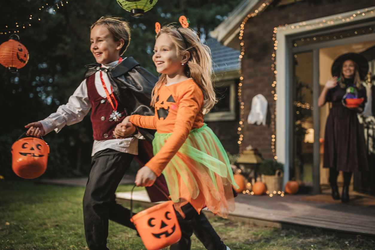 Young kids trick or treating during Halloween.